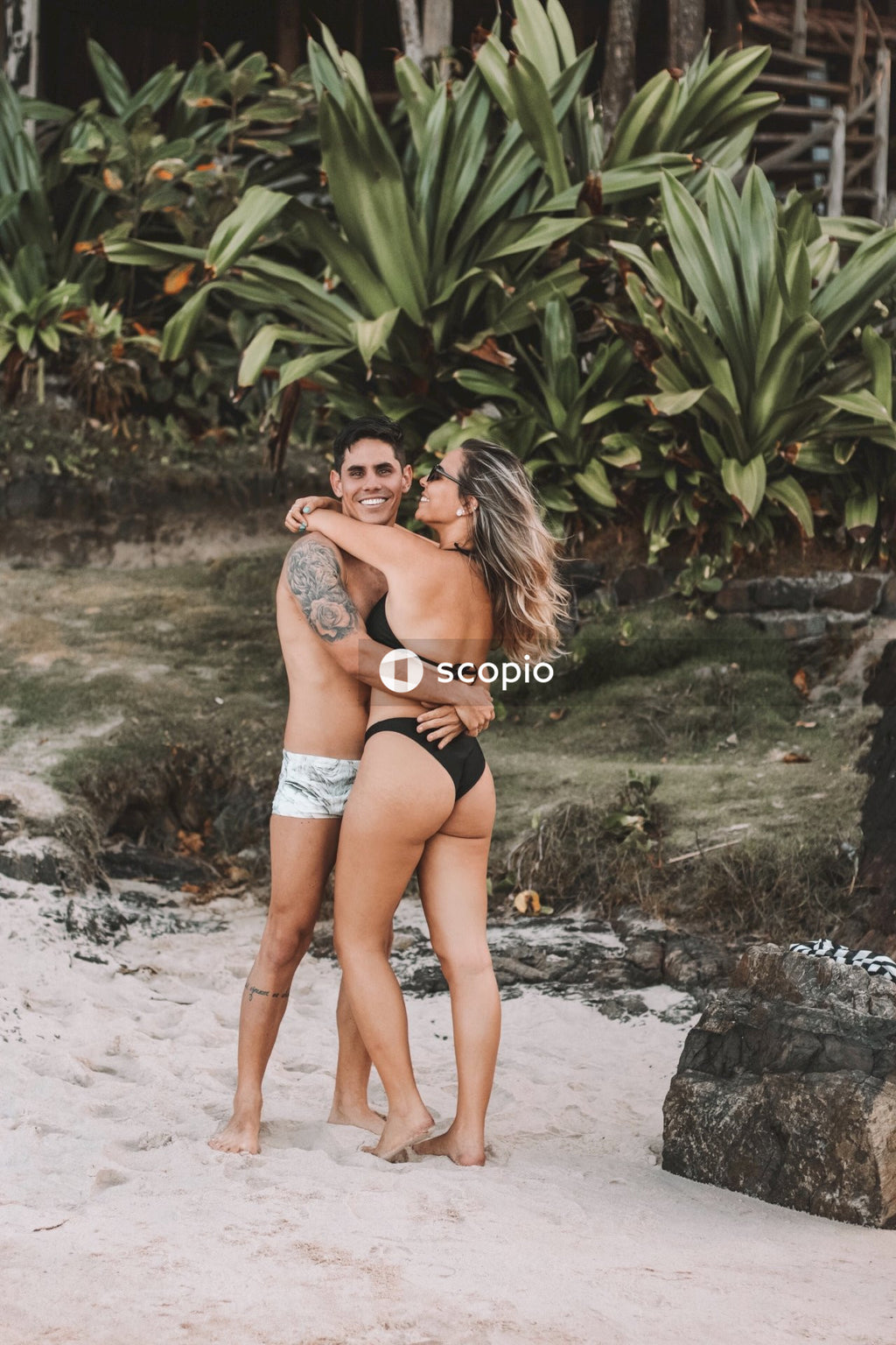 Man and woman hugging at the beach