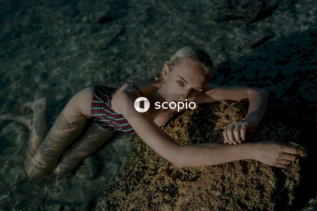 Woman in bathing suit lying in water
