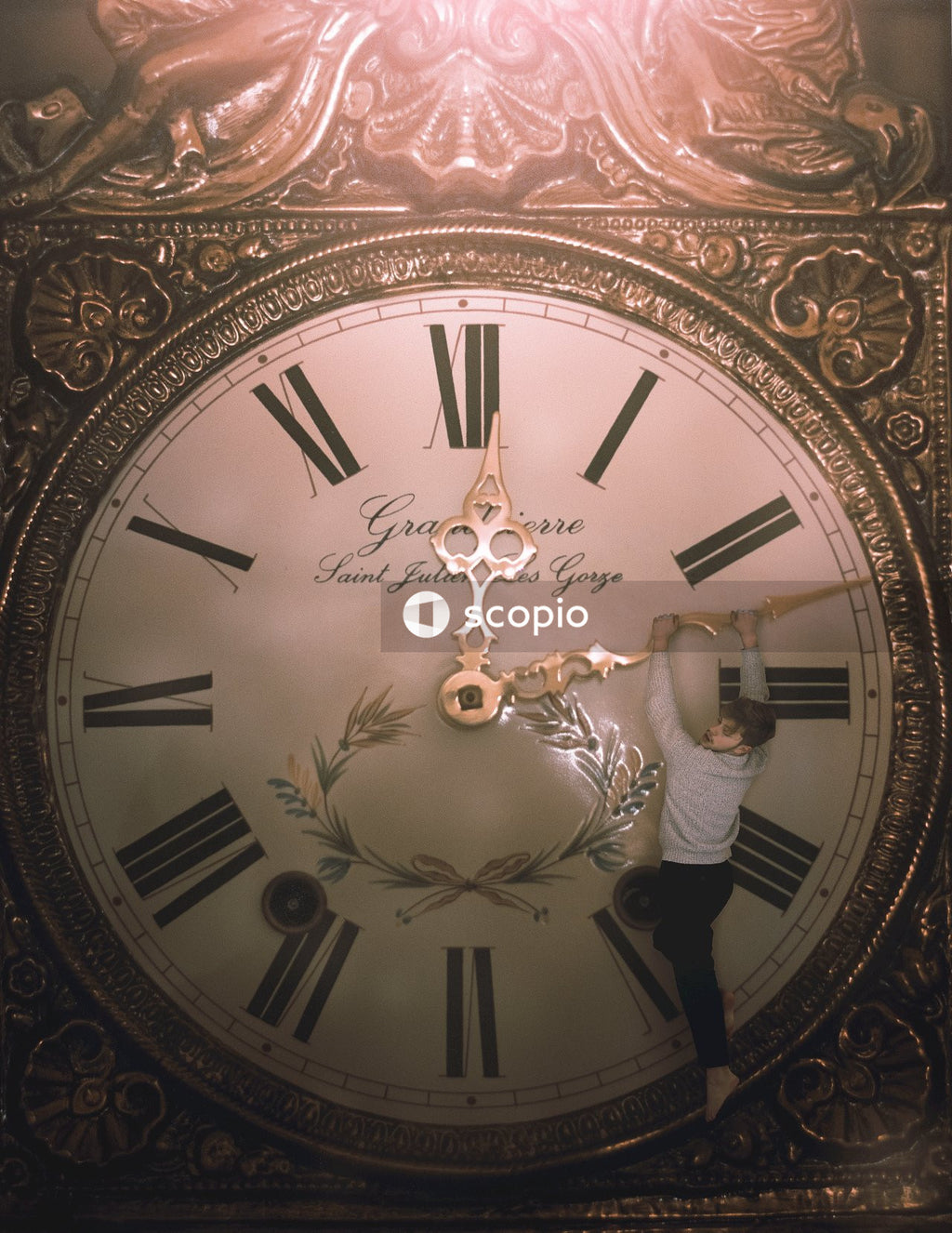 Man holding clock long fingers