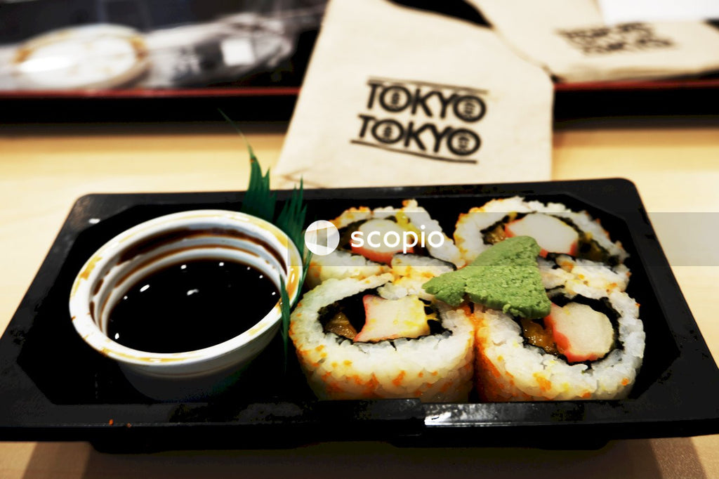 White and black ceramic bowl with food