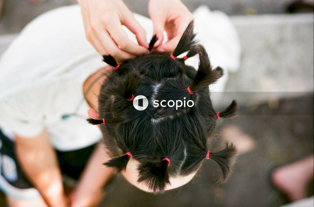 Person making someone's hair