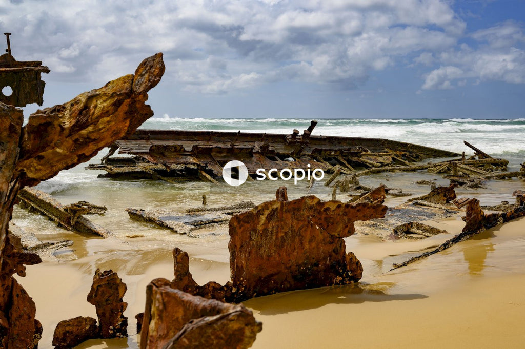 Brown rock formation on beach