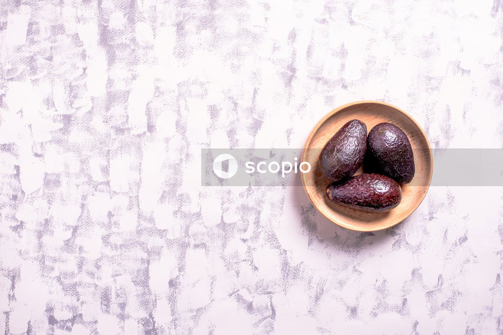 Black and brown stones on white ceramic bowl