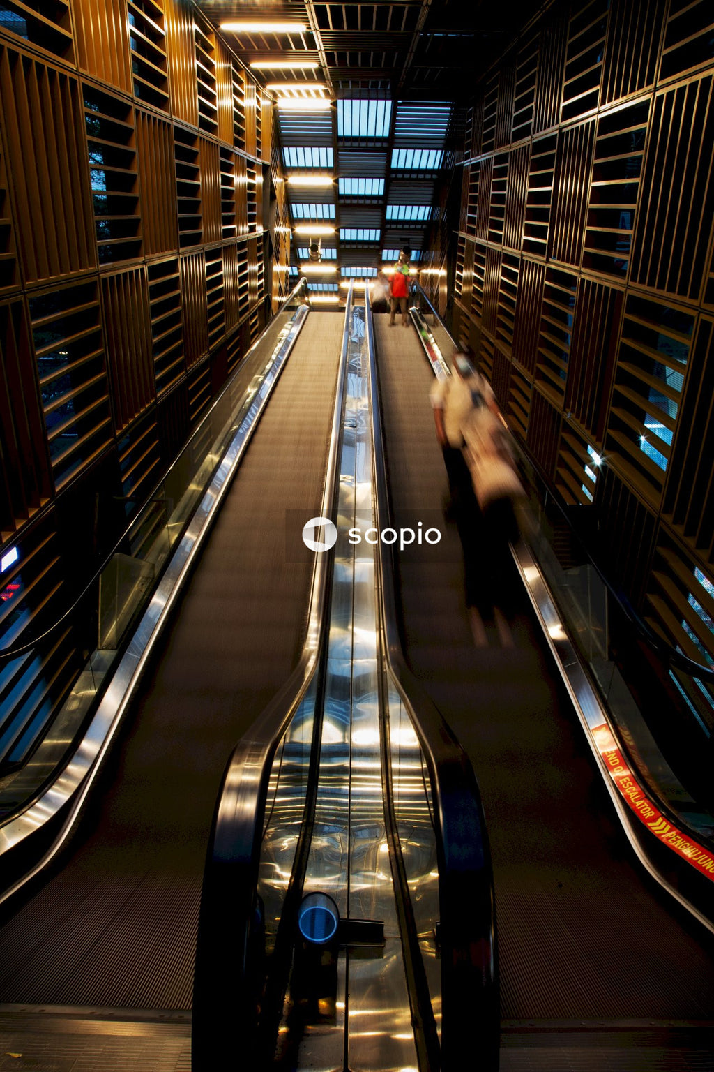 Black and white escalator in a building
