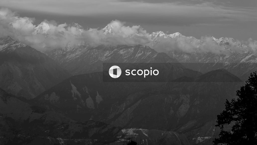 Black and white mountains under white clouds