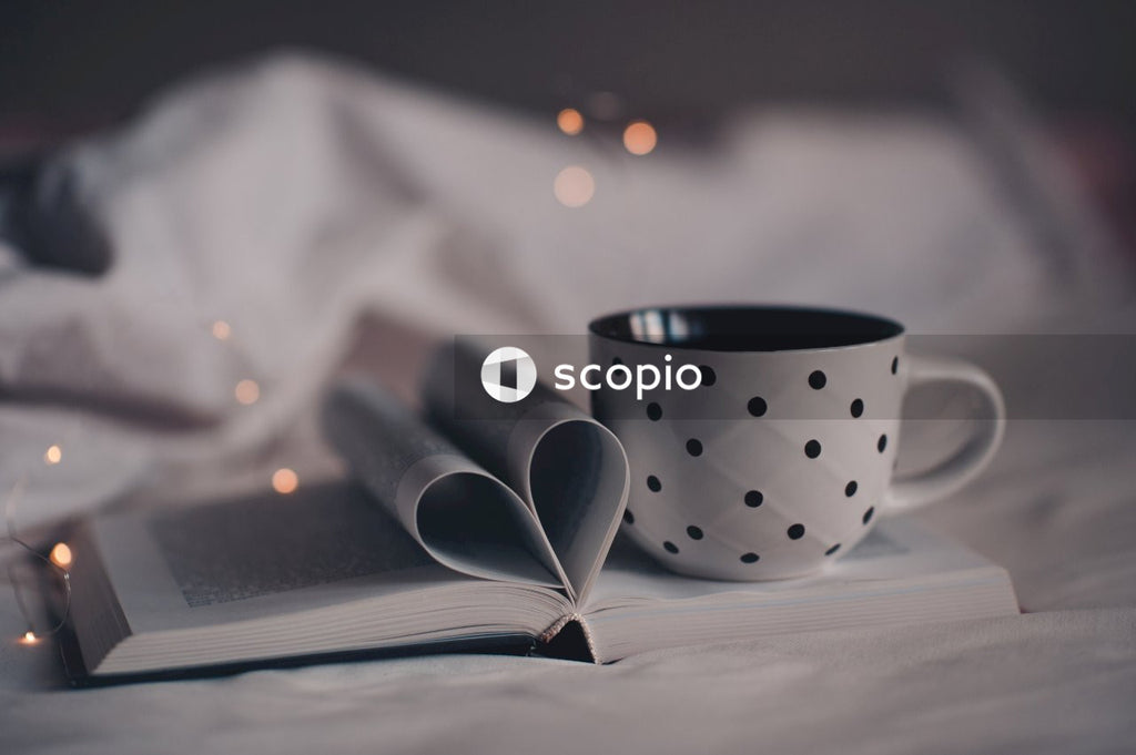 Black and white polka dot ceramic mug on white and black polka dot paper