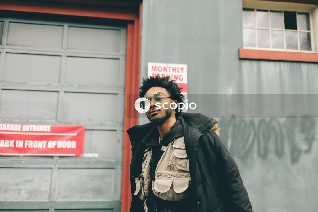 Black man with sunglasses standing outdoor