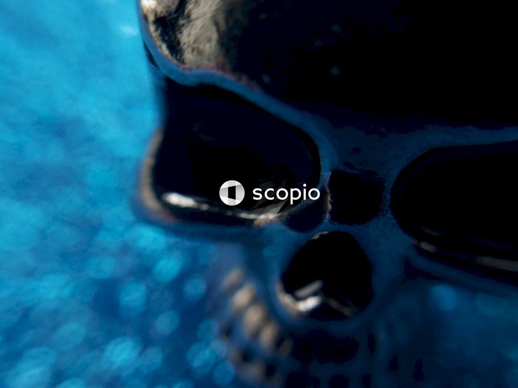Black round metal on blue textile