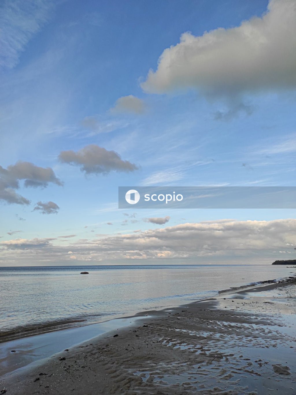 Body of water under blue sky