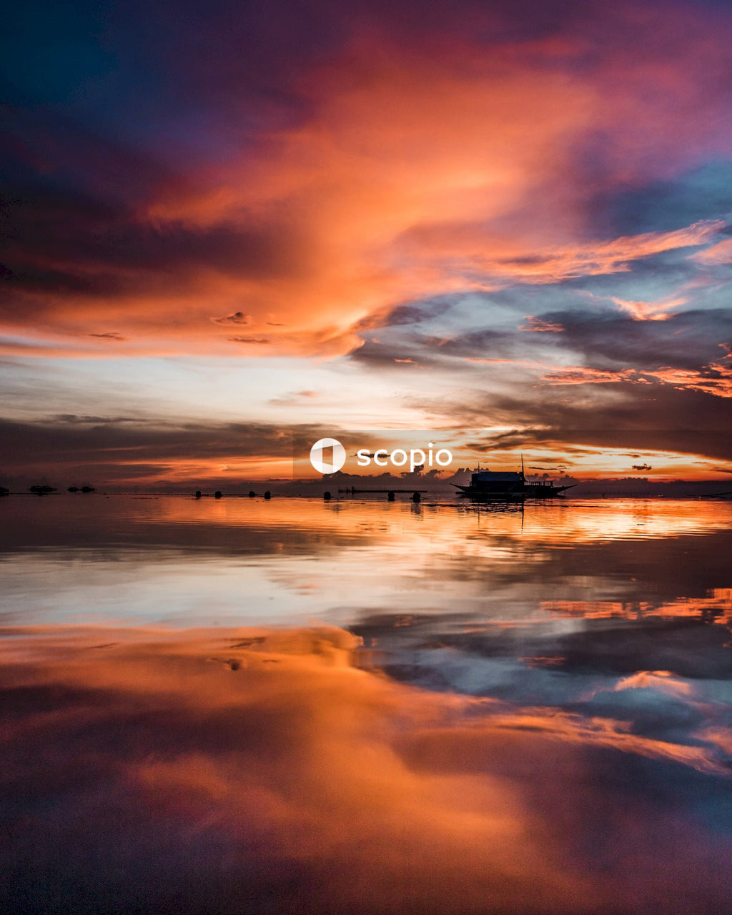Body of water under cloudy sky during sunset