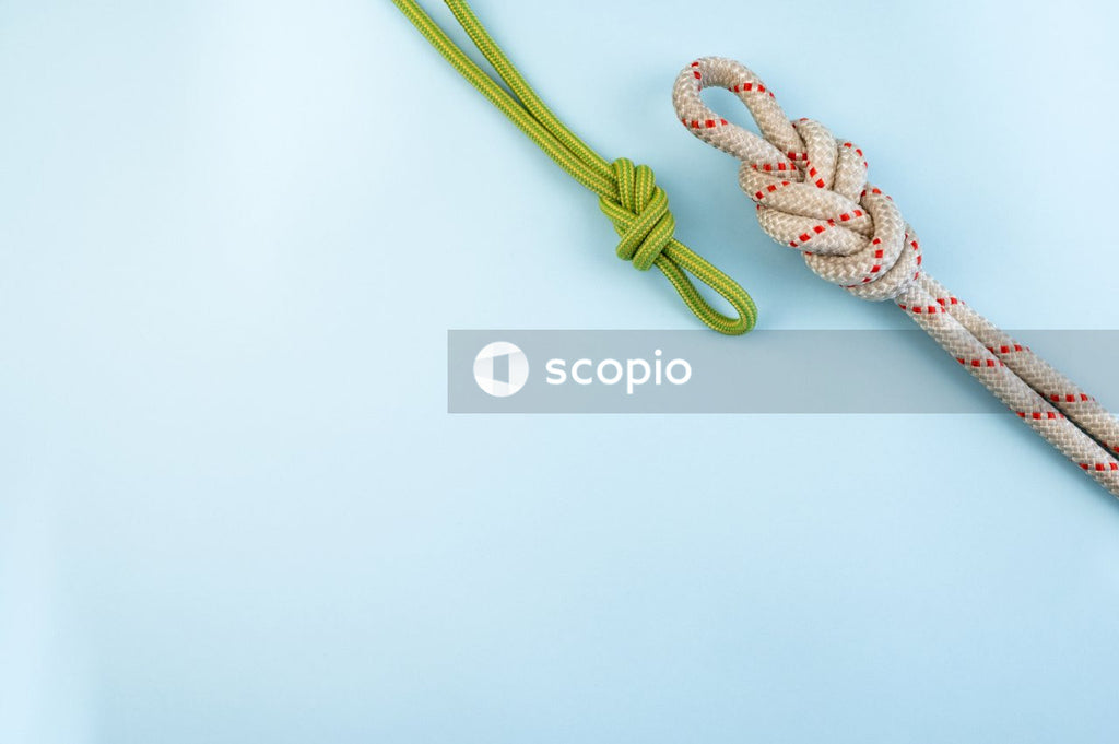 Brown and green rope on white surface