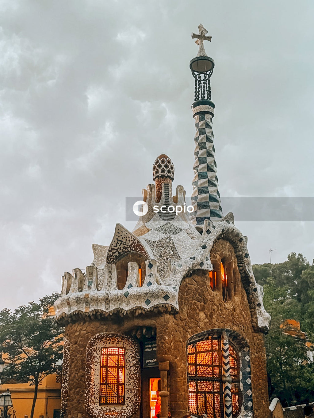 Brown and white concrete building under white clouds