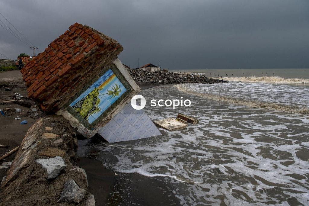 Brown and white concrete house on seashore