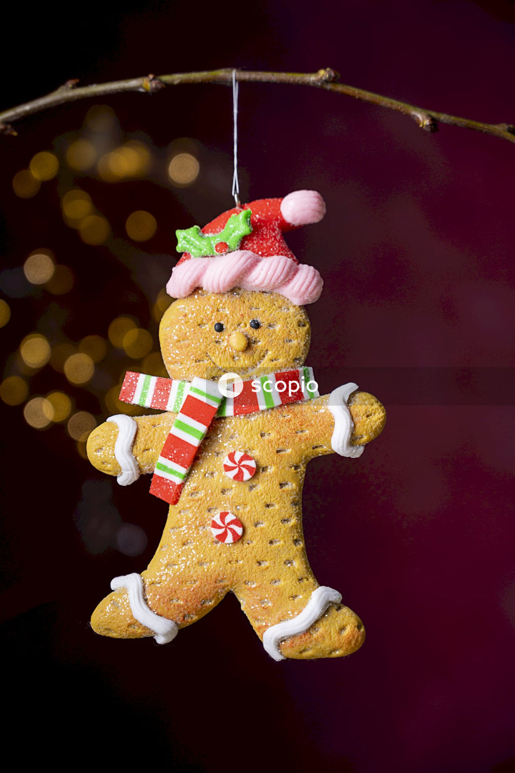 Brown bear plush toy with red ribbon