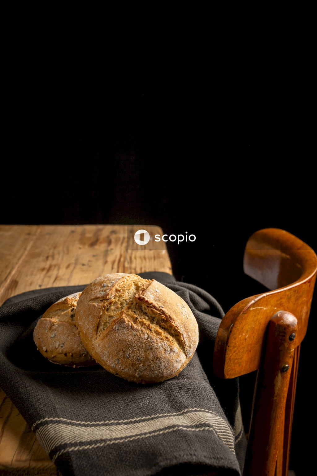 Brown bread on brown wooden chopping board
