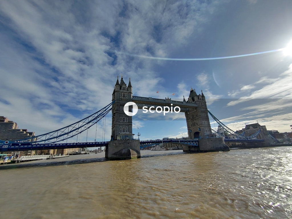 Brown bridge under blue sky and white clouds