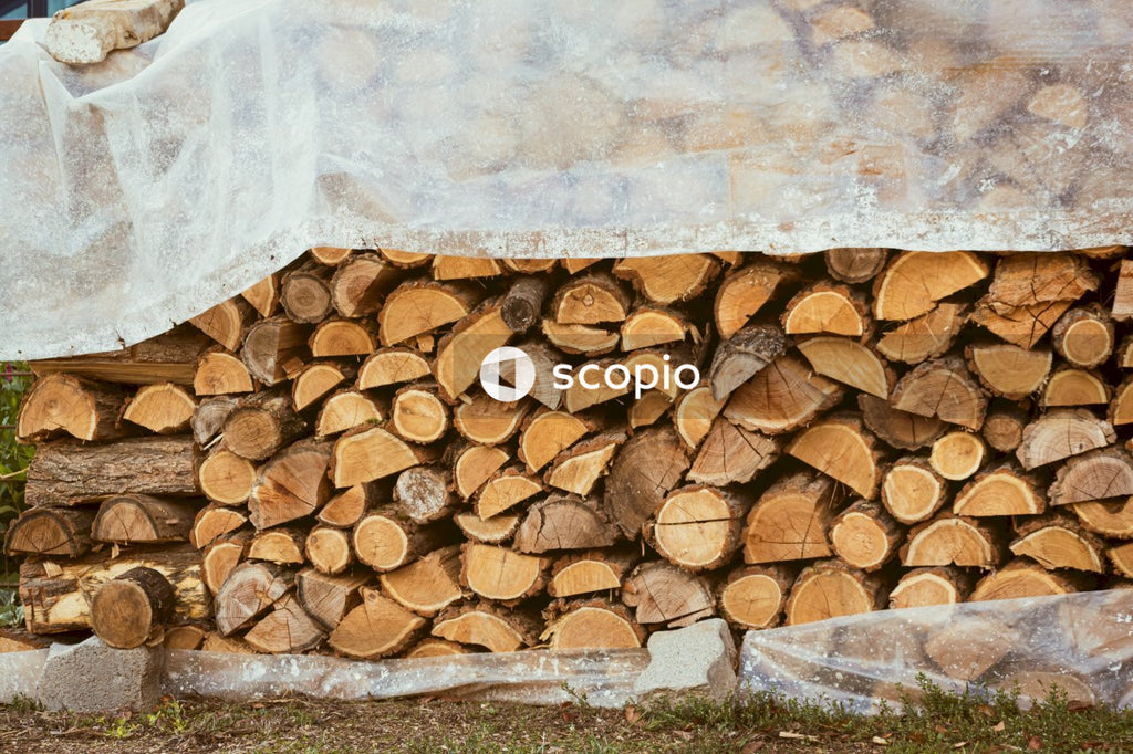 Brown firewood stack on gray concrete floor