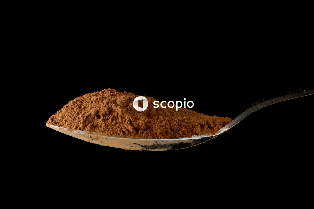 Brown powder in stainless steel bowl