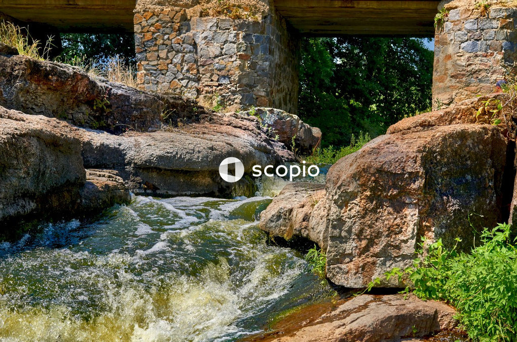Brown rock formation on river