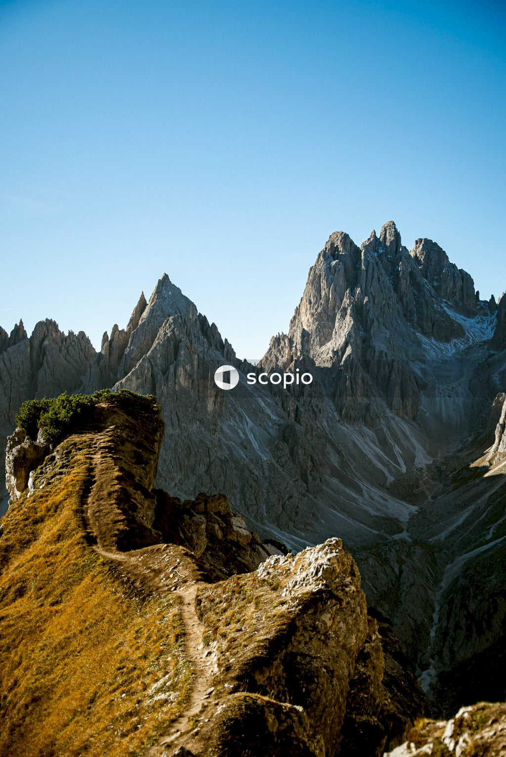 Brown rocky mountain under blue sky