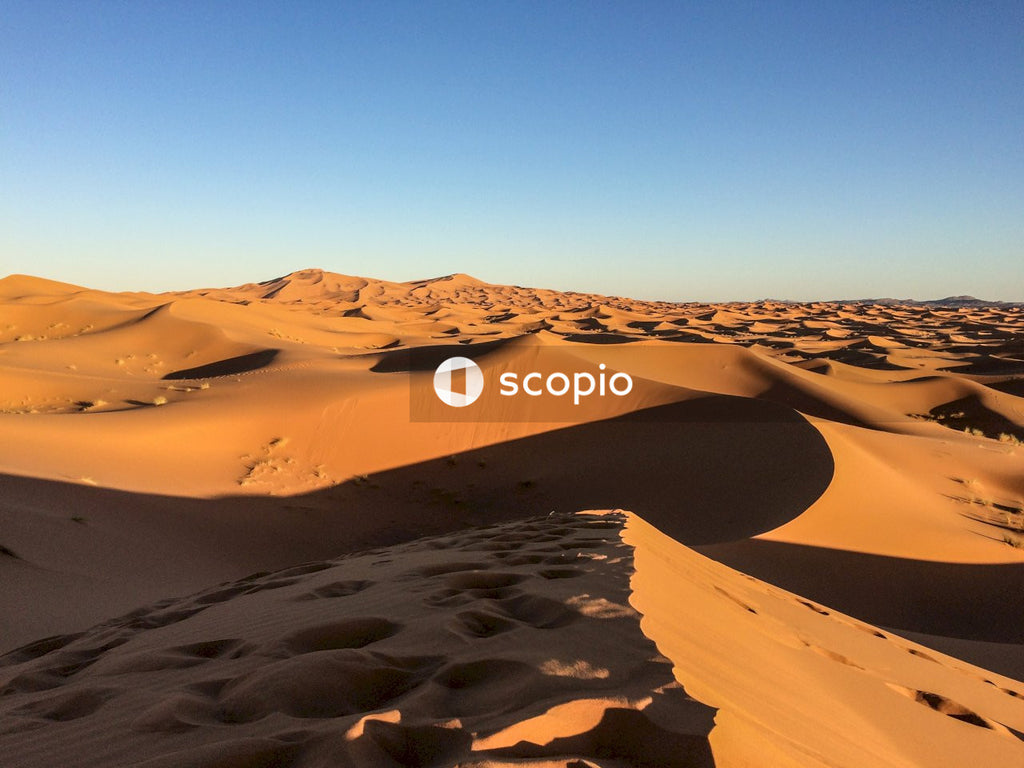 Brown sand under blue sky