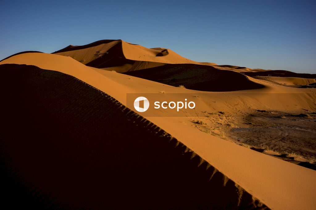 Brown sand under blue sky
