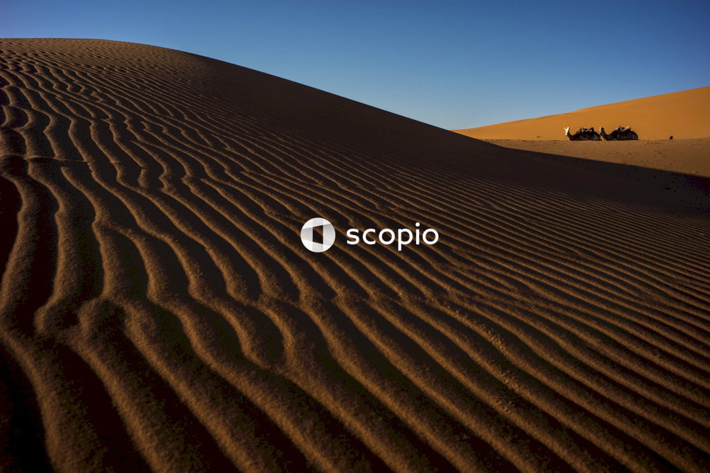 Brown sand under blue sky
