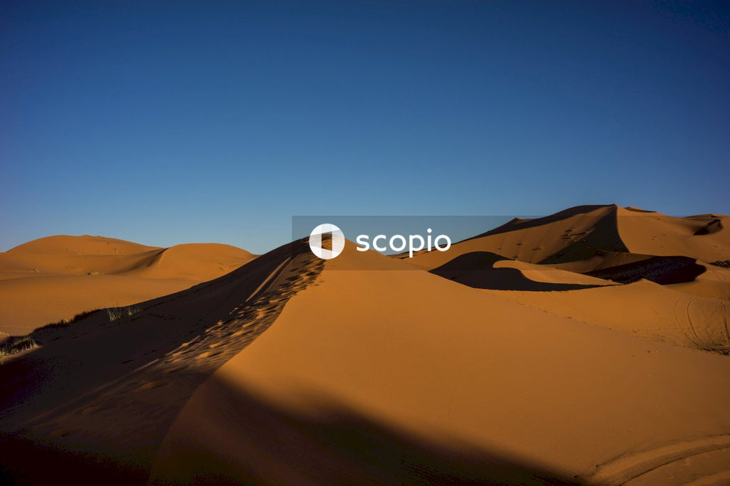 Brown sand under blue sky