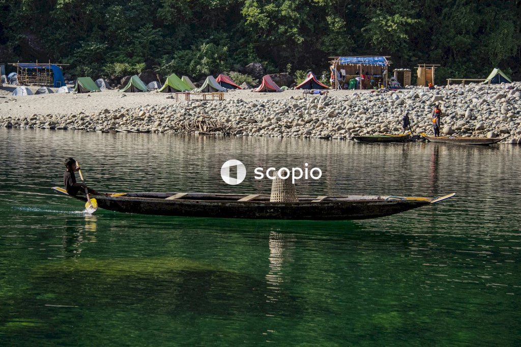 Brown wooden boat on river