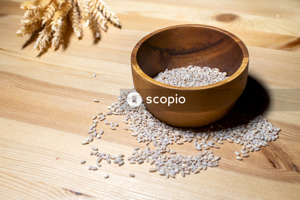 Brown wooden bowl with brown dried leaves
