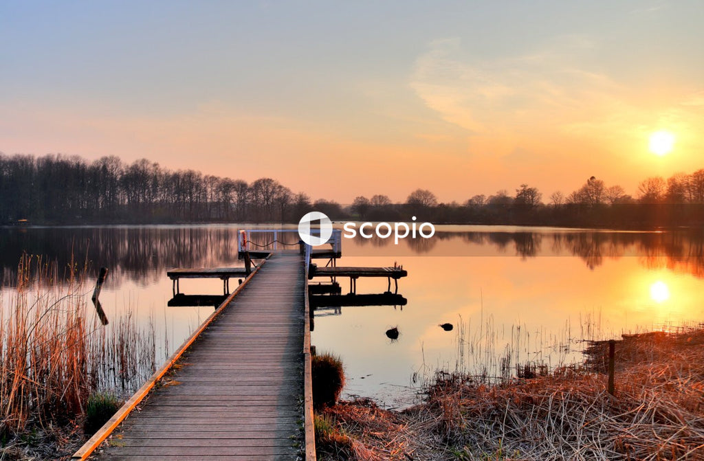 Brown wooden dock on lake