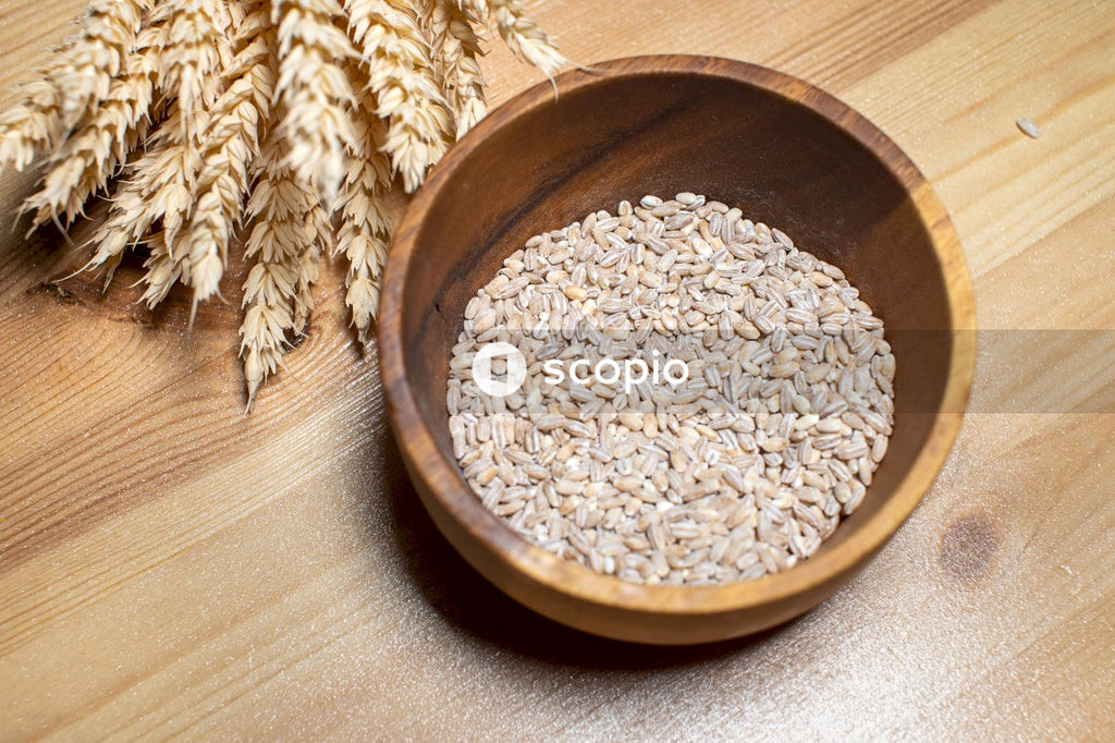 Brown wooden round bowl with rice