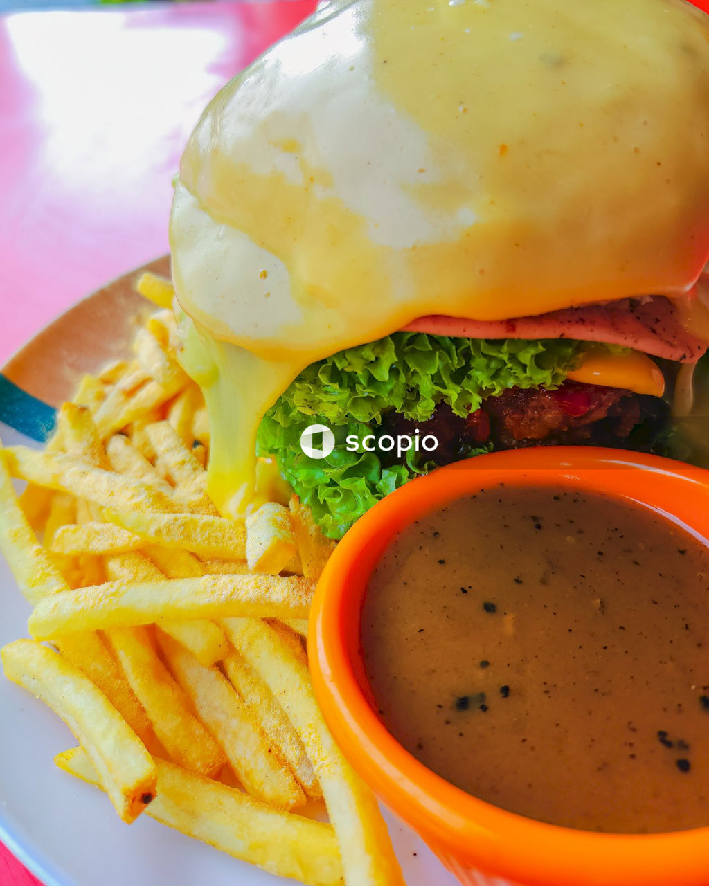 Burger and fries on plate