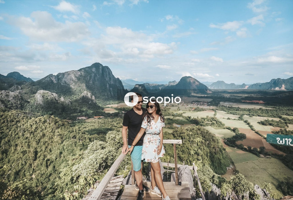Woman and man leaning on handrail