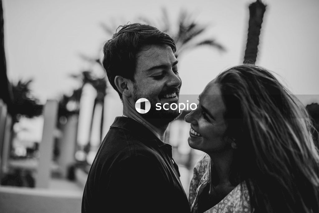 Man and woman smiling in grayscale