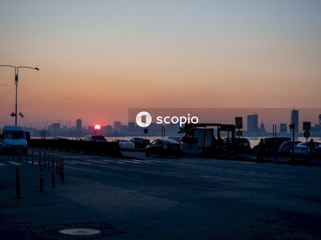Cars parked on parking lot during sunset