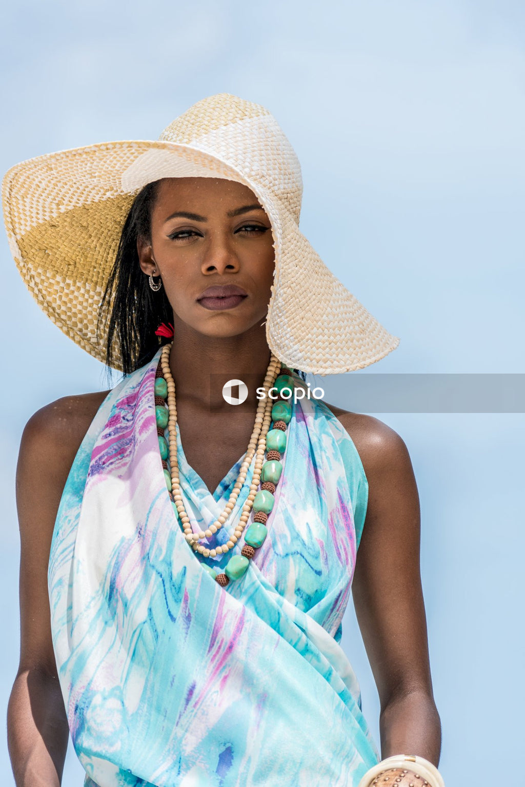 Caymanian woman with sunhat standing outdoor