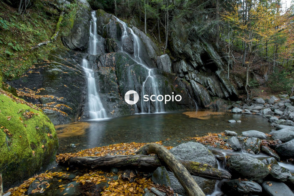 Water falls on rocky river
