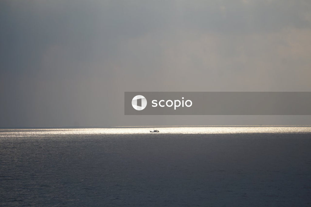 Body of water under gray sky