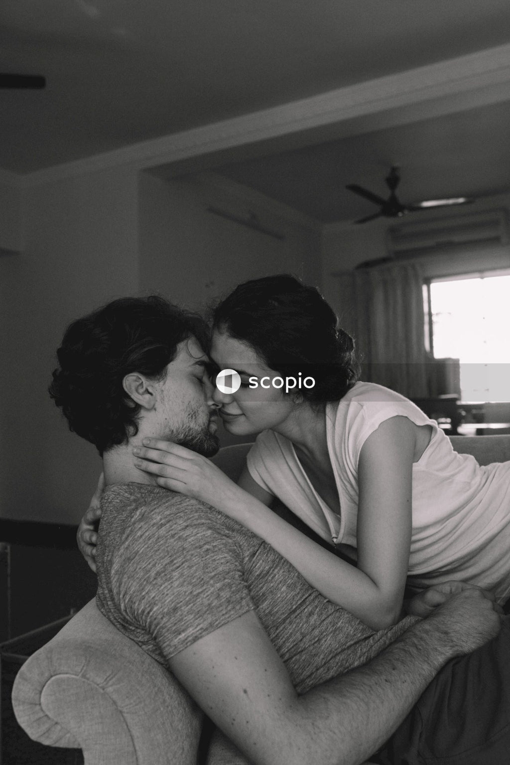 Man kissing womans forehead