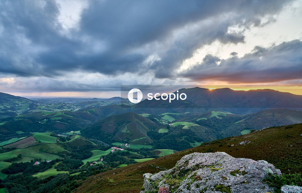Green mountains under white clouds