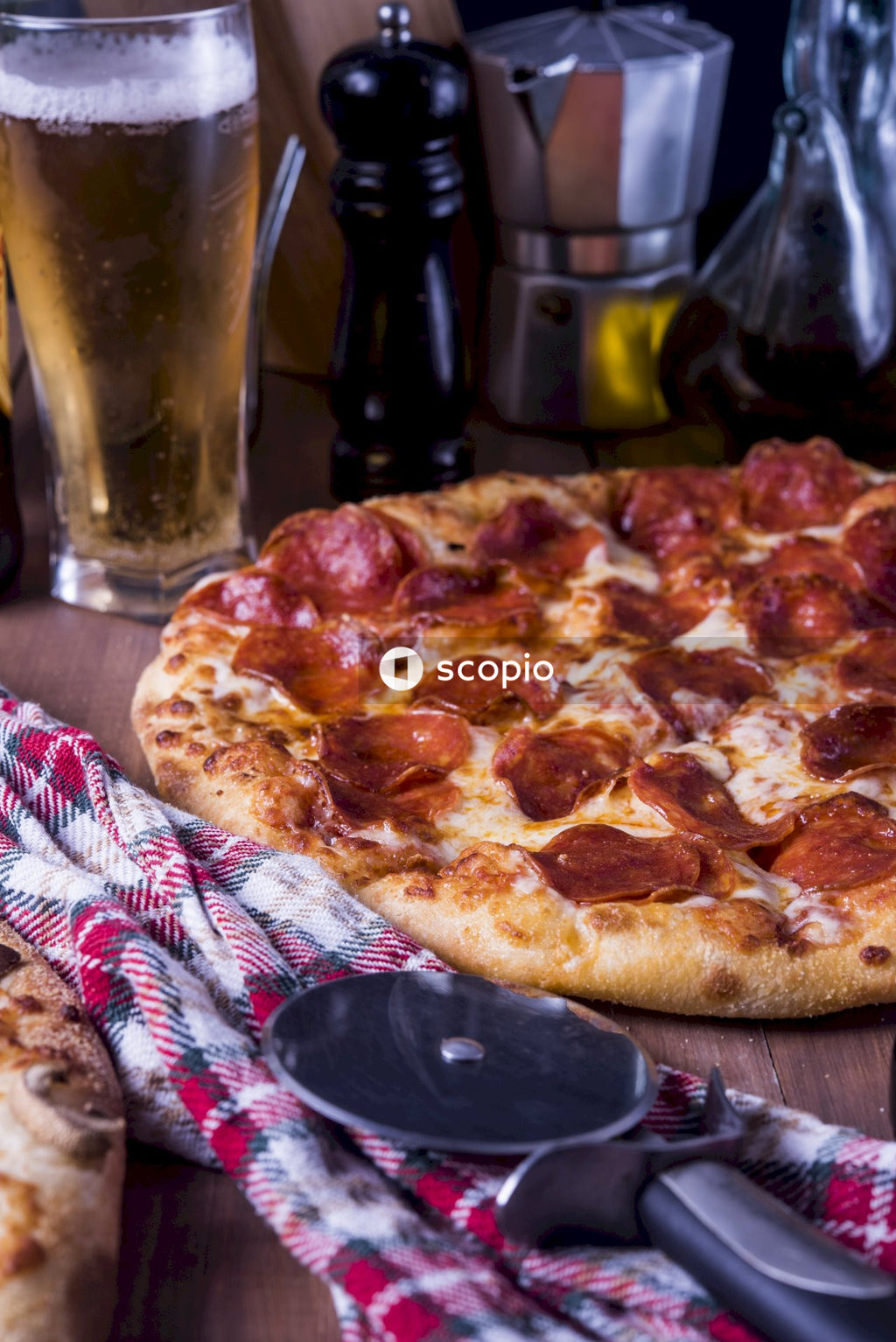 Pizza on white and red table cloth