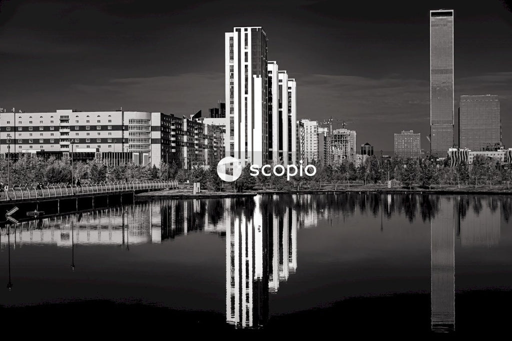 City skyline near body of water during night time