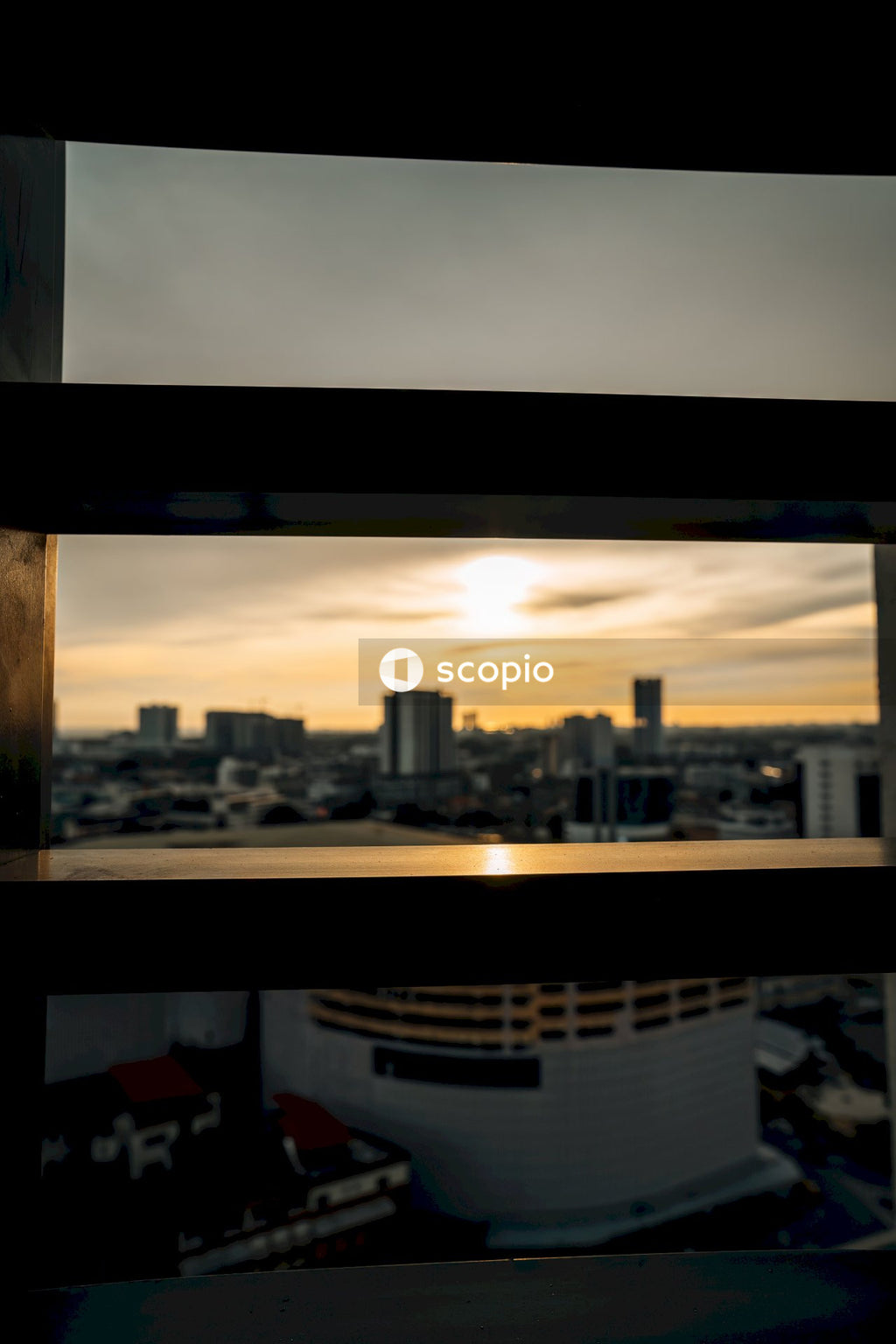 City skyline under cloudy sky during sunset