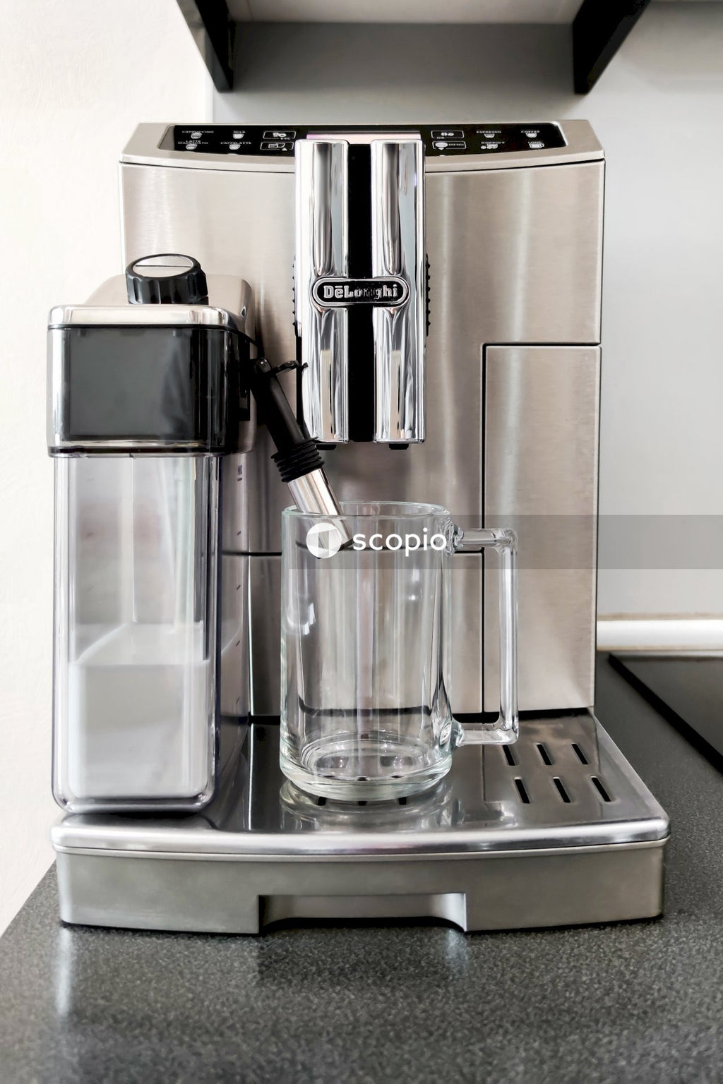 Clear drinking glass on stainless steel tray