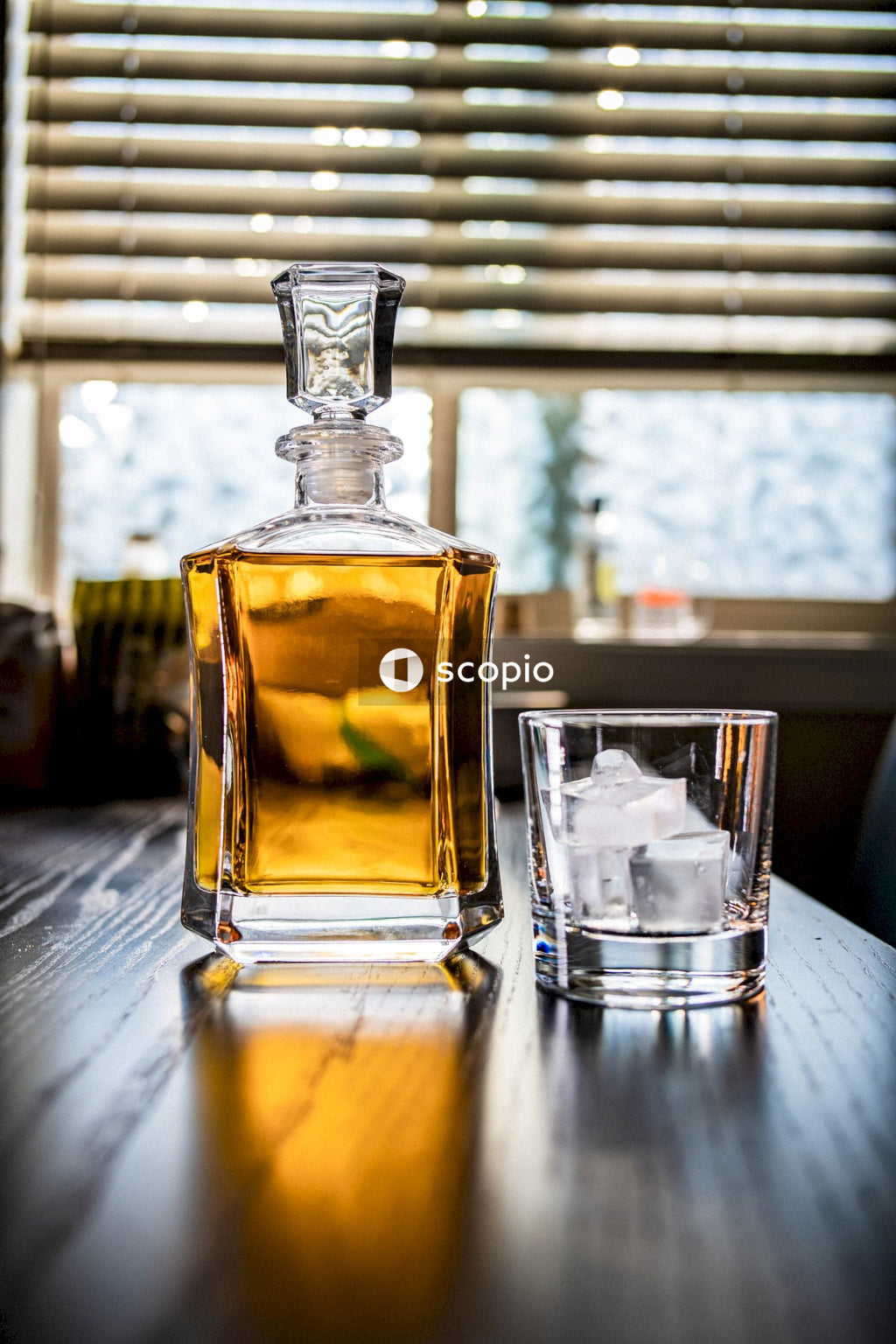 Clear glass bottle with yellow liquid