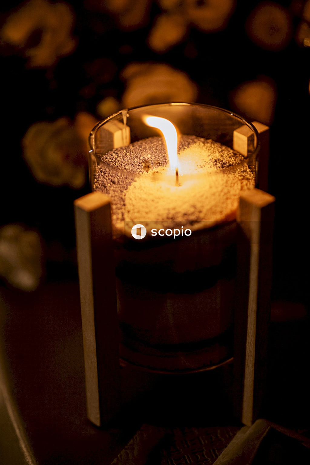 Clear glass candle holder with white candle