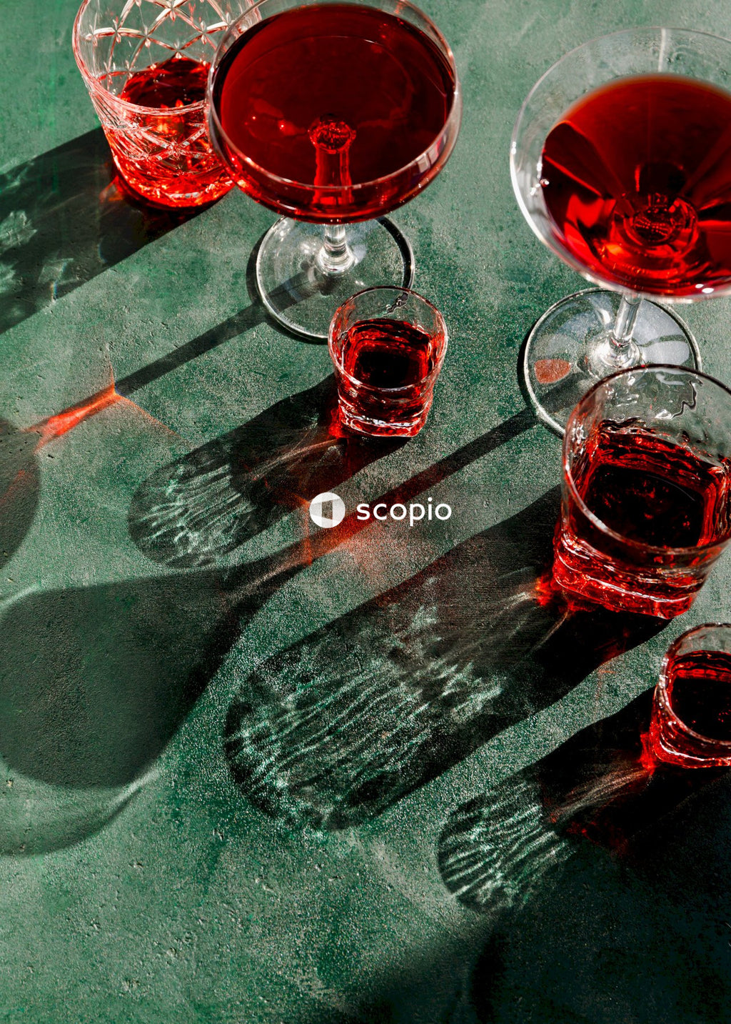 Clear glass cup on gray and red stripe table cloth