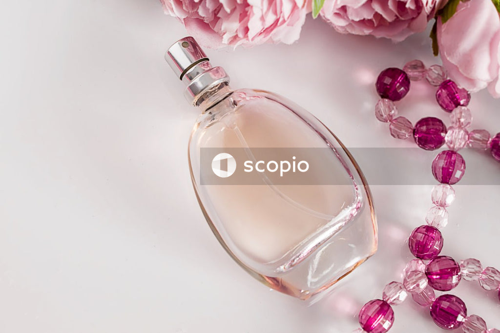 Clear glass perfume bottle on white table