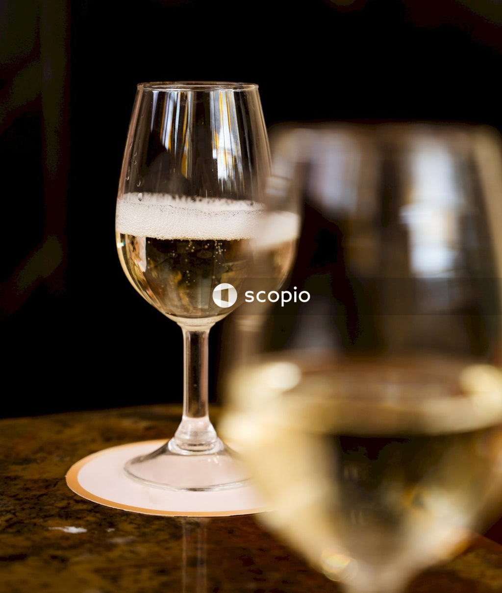 Clear wine glass on brown wooden table